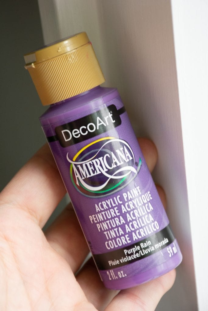 bottle of purple acrylic paint
