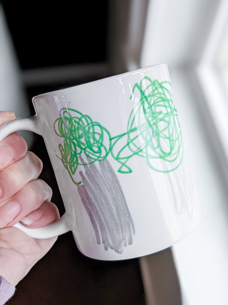 kids drawing transferred onto a mug using infusible ink