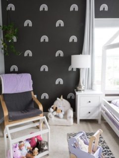 black wall with white rainbow wall decals made with Cricut