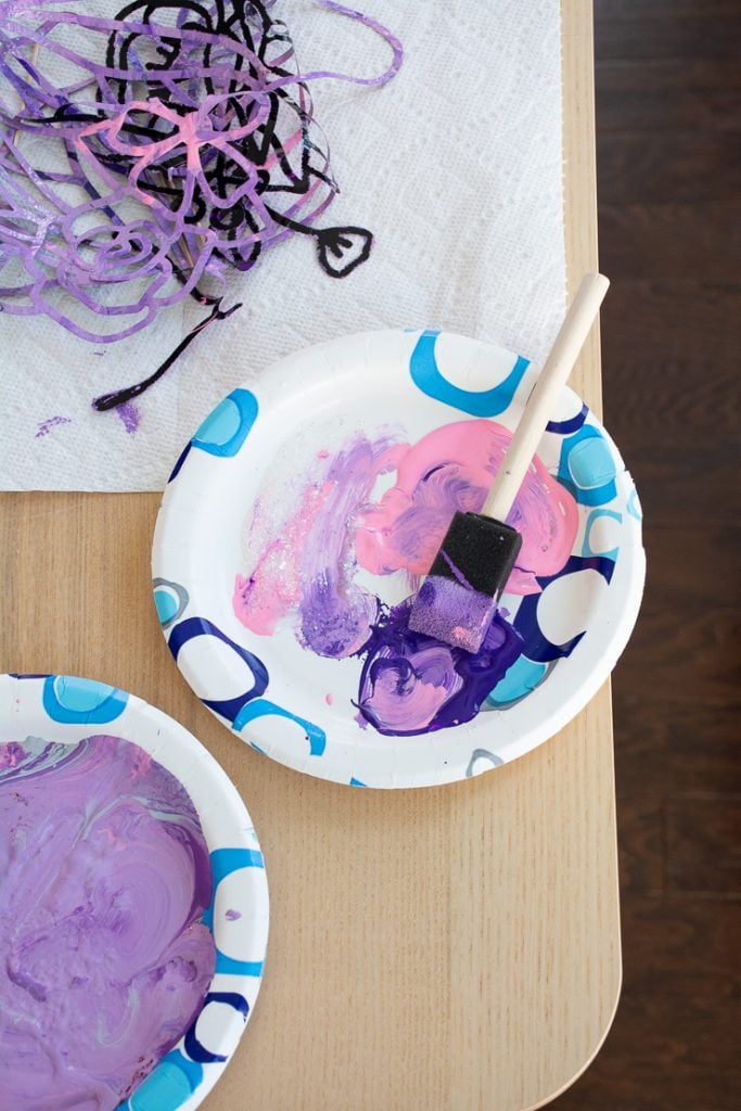 purple and pink paint on a plate