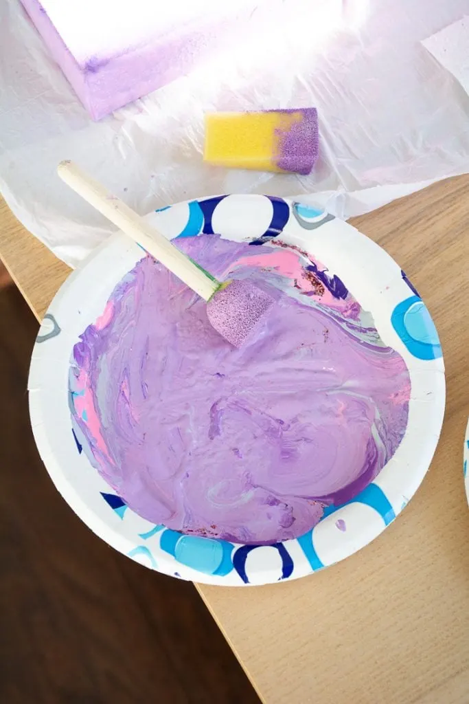 mixing acrylic paints on a paper plate