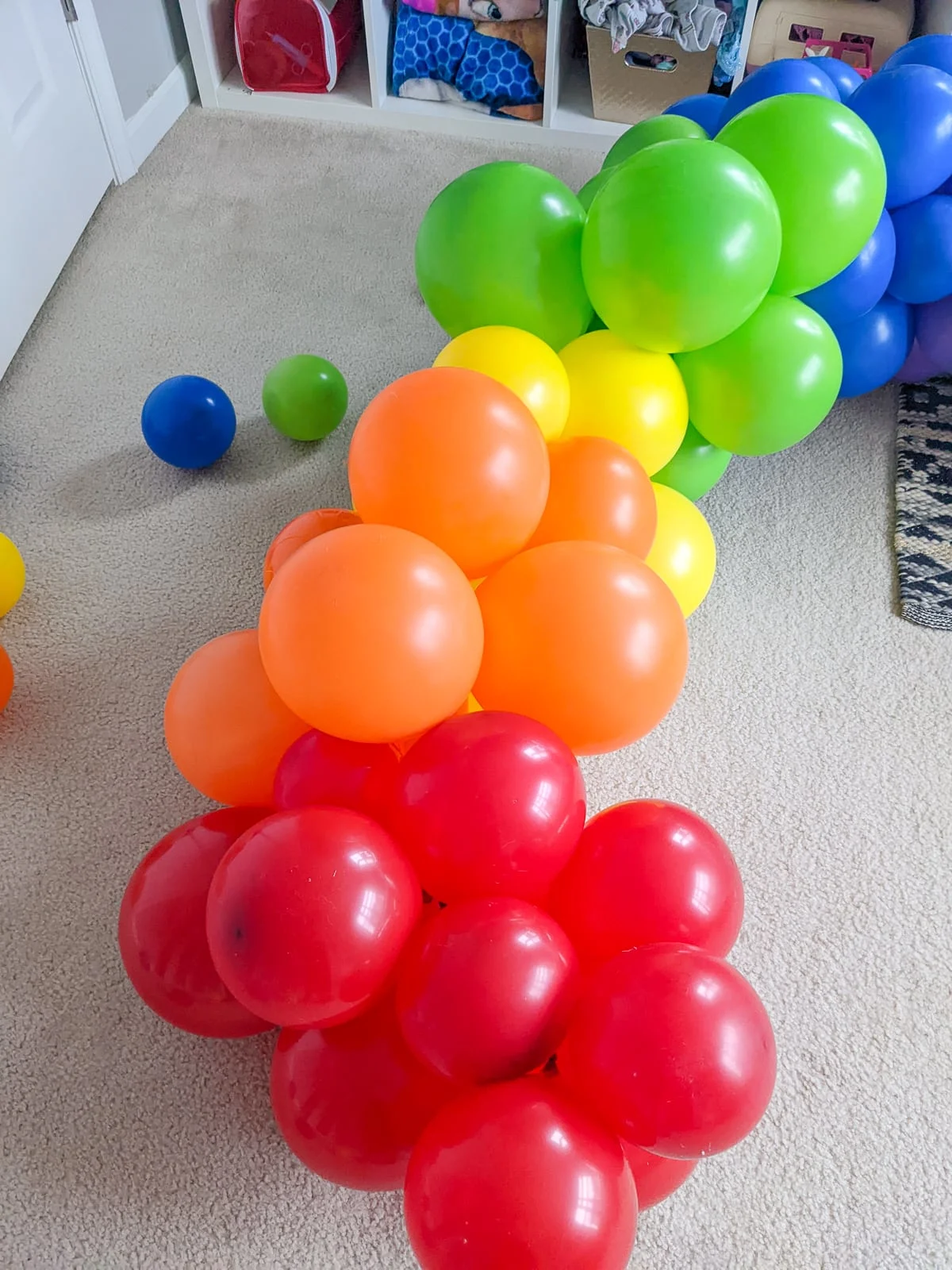 attaching balloons for a DIY balloon arch