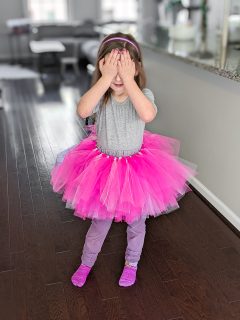 little girl with a pink and white homemade tutu on