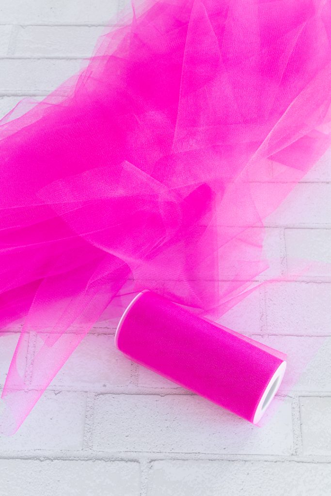 bright pink tulle pieces on a workspace