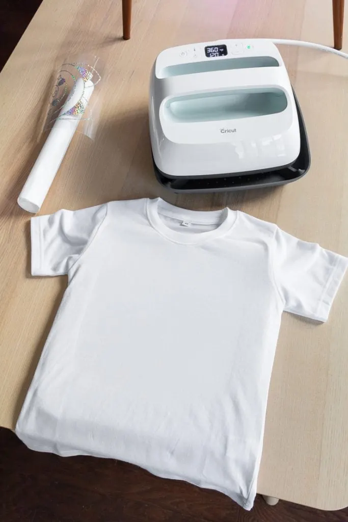 white t-shirt laid out on a table