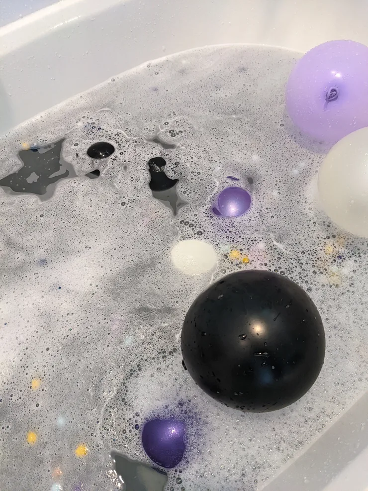tub full of bubbles and balloons