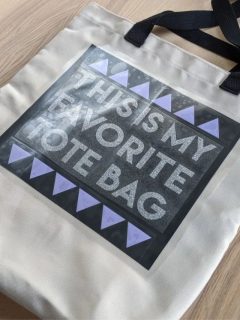 tote bag with vinyl layering that says this is my favorite tote bag