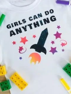 image of t-shirt with Girls can do anything, a rocket and stars