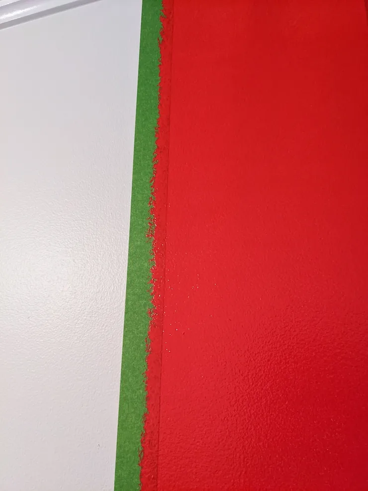 painting red onto a wall