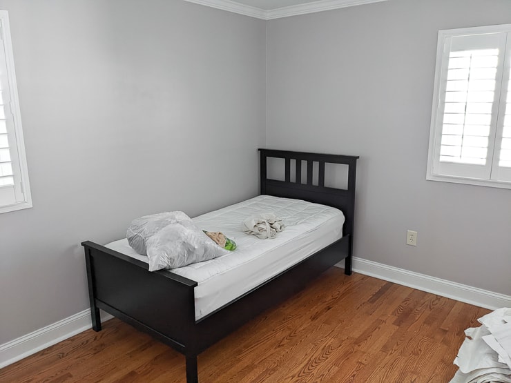 plain bedroom with a twin-sized bed in it