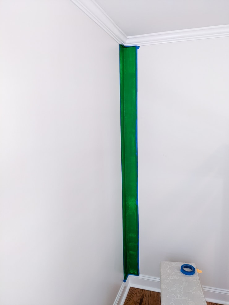 painting a green stripe on a wall