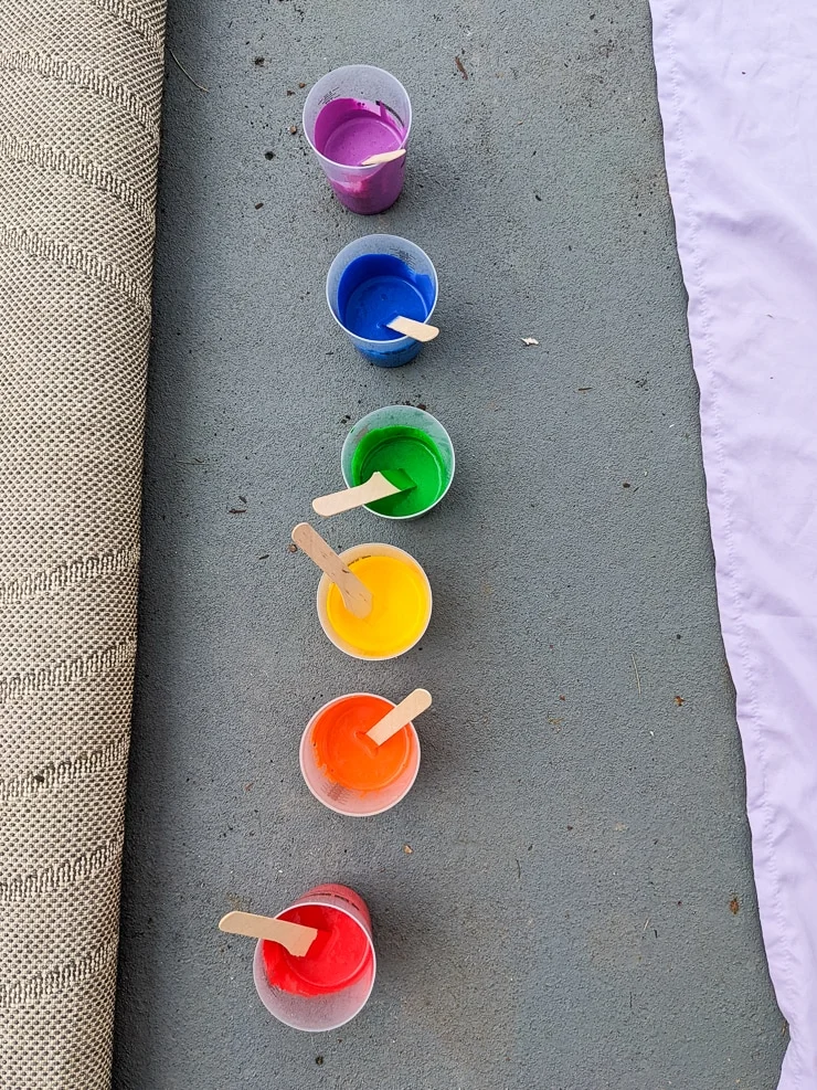 rainbow paints lined up in cups