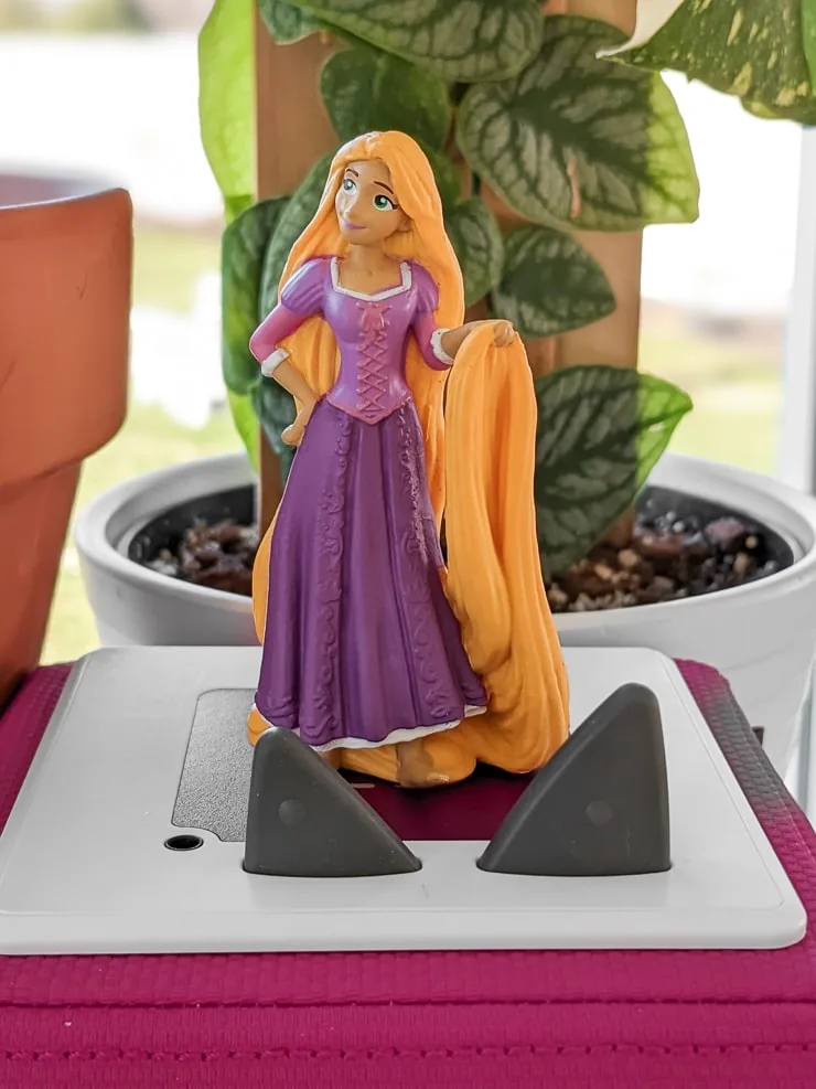 Rapunzel Tonie on top of a pink Toniebox