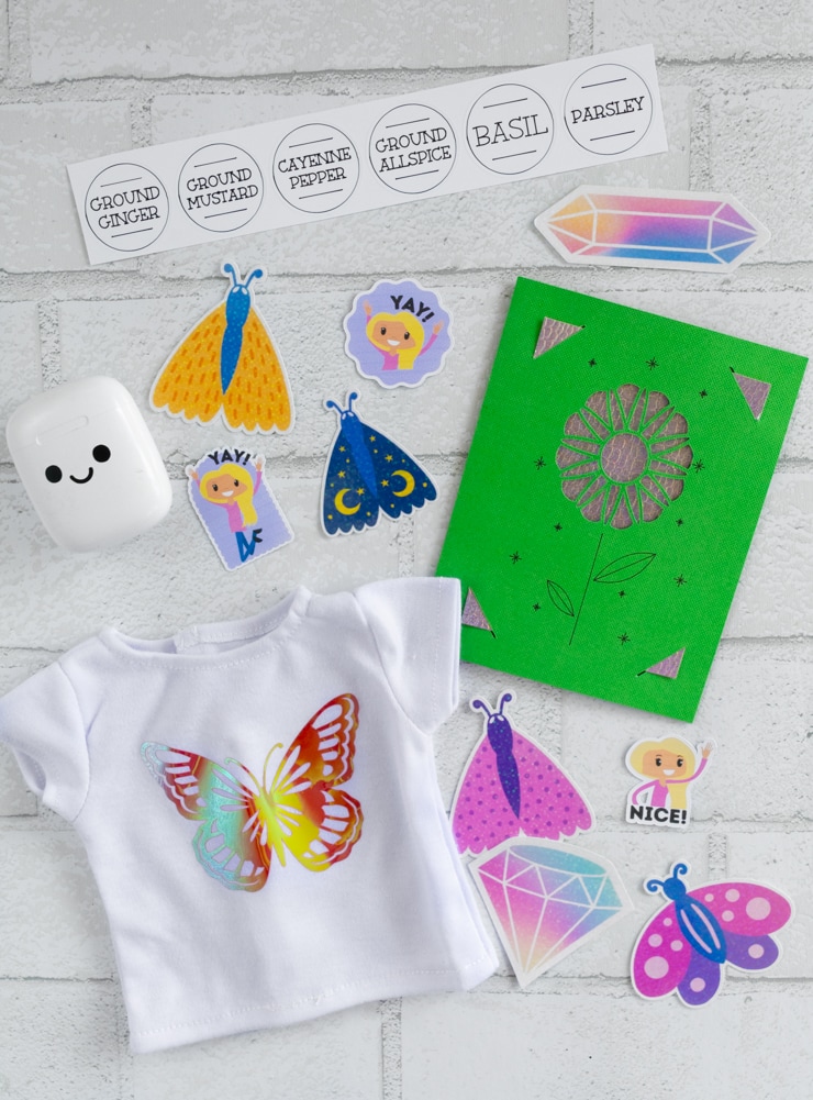 stickers, a shirt, a card, and labels made with a cricut joy xtra