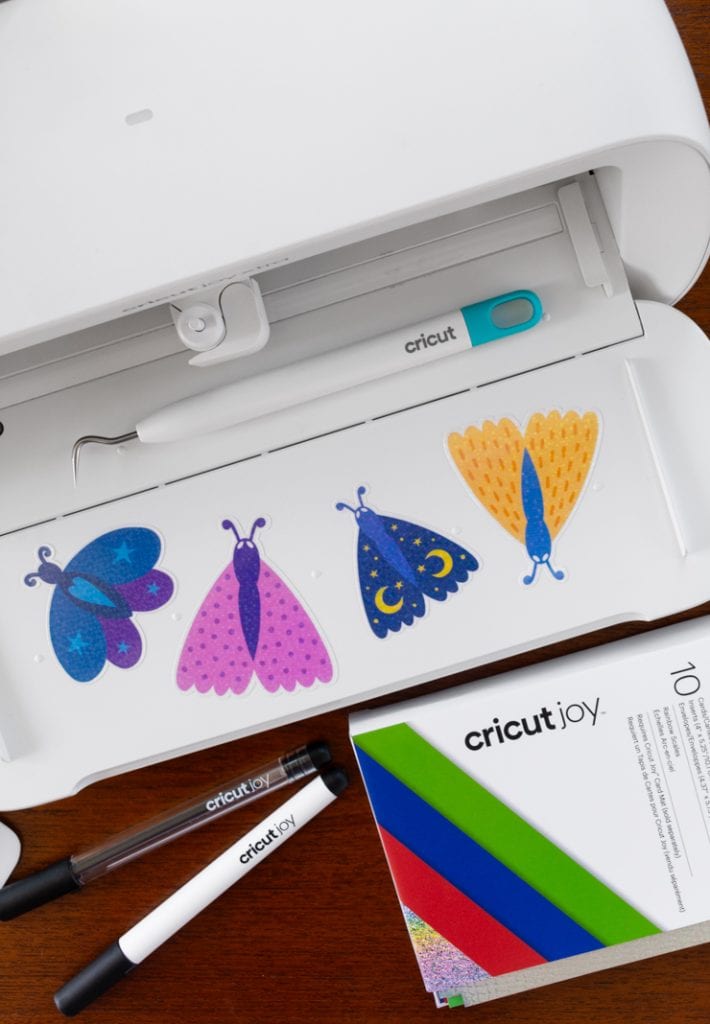 overhead shot of cricut joy xtra with stickers on it