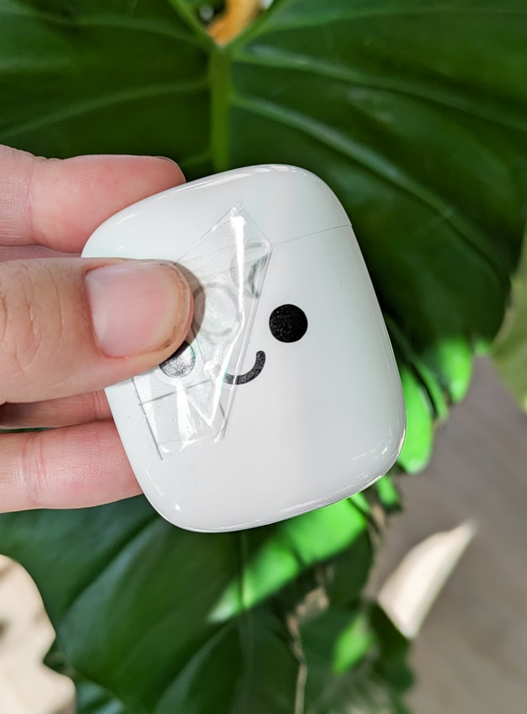 face decal added on an earbud container