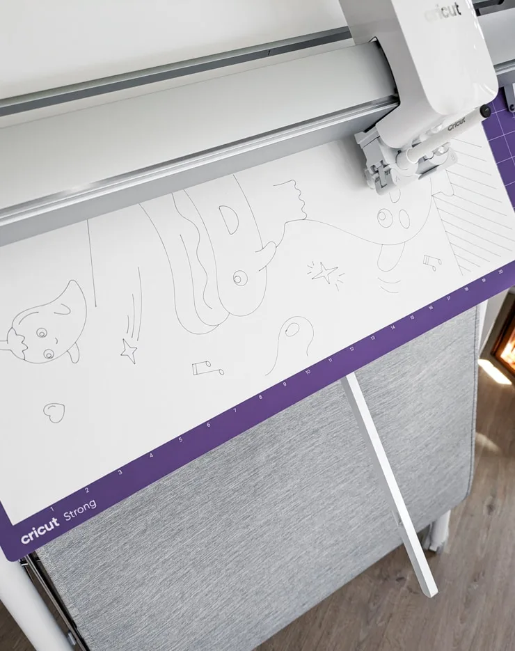 drawing a coloring page on poster board with a cricut venture