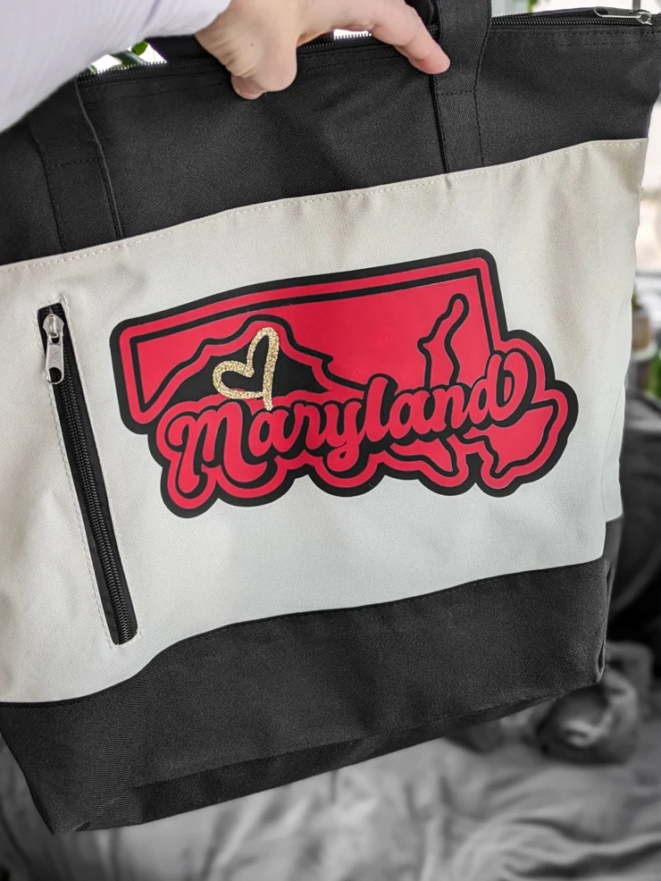 tote bag that says Maryland on it in red and black