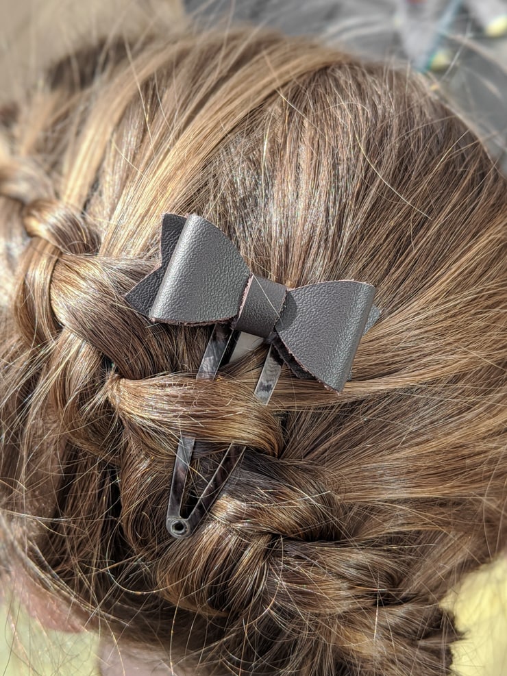 leather hair bow in hair